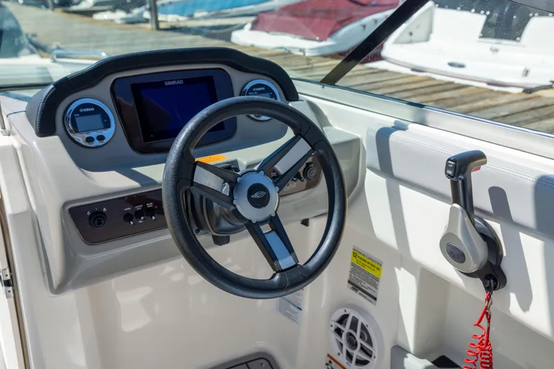 Slide: The Image of Cockpit view of 2022 Chaparral 21 SSi OB boat with steering wheel and controls. - 14
