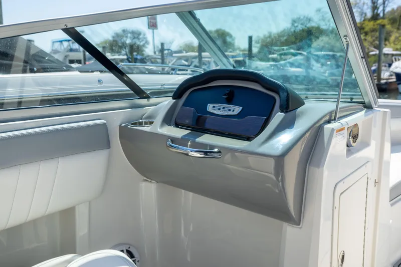 Slide: The Image of 2022 Chaparral 21 SSi OB boat interior with sleek dashboard and windshield. - 15