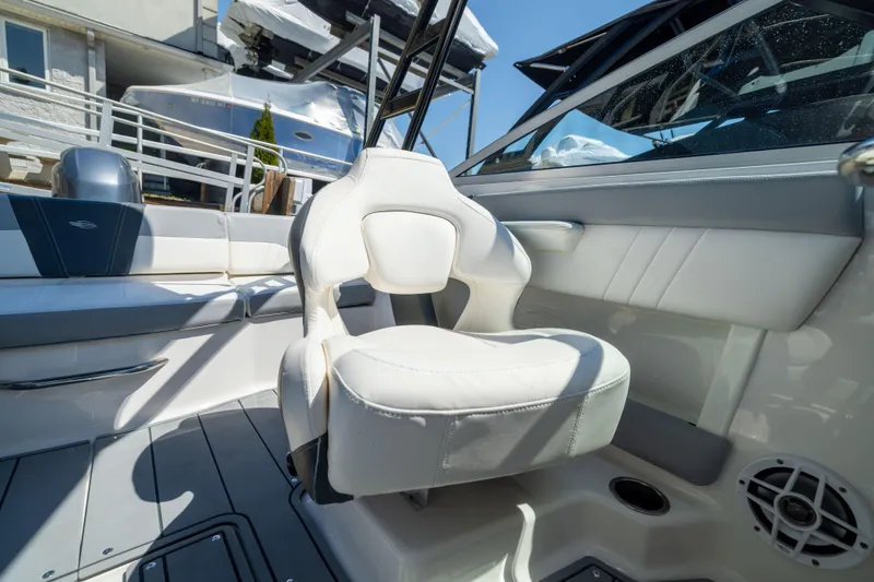 Slide: The Image of Interior of 2022 Chaparral 21 SSi OB boat with white seating and modern design. - 16