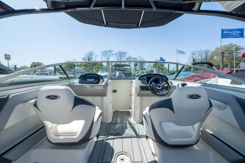 Slide: The Image of Interior view of 2022 Chaparral 21 SSi OB boat with modern dashboard and seating. - 18