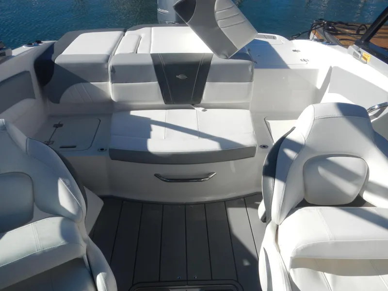 Slide: The Image of 2022 Chaparral 21 SSi OB boat interior with white seating and gray accents. - 4