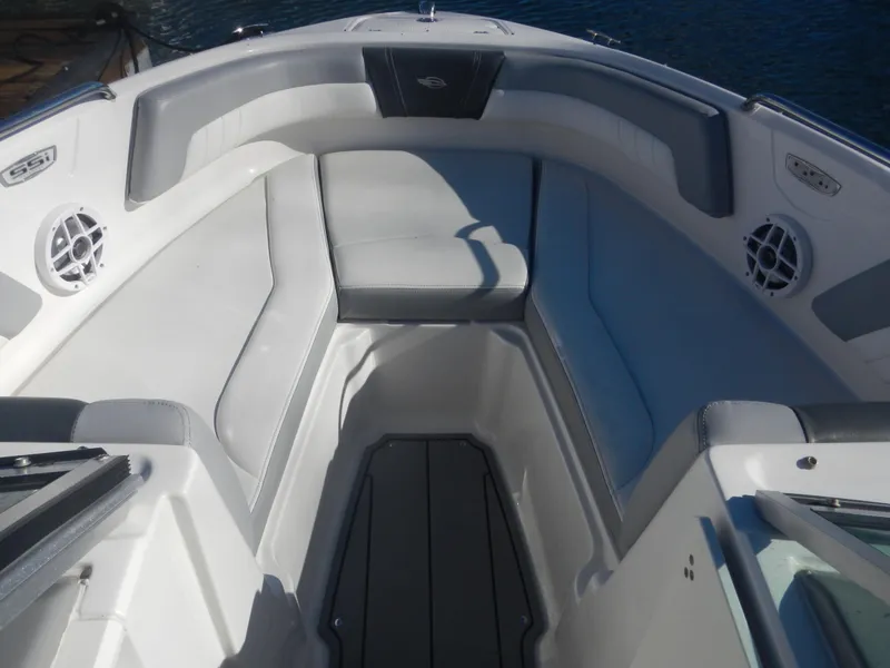 Slide: The Image of 2022 Chaparral 21 SSi OB boat interior with cushioned seating and speakers. - 5
