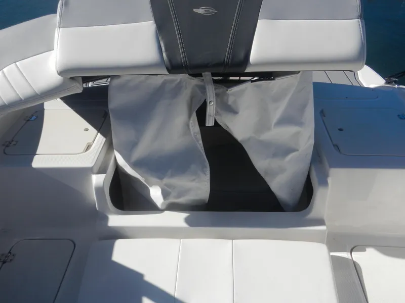 Slide: The Image of 2022 Chaparral 21 SSi OB boat interior seating with storage compartment. - 8