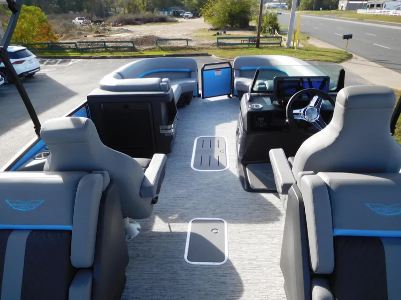 Slide: The Image of Interior of 2025 Bennington 24 MFB pontoon boat with modern seating and steering console. - 10