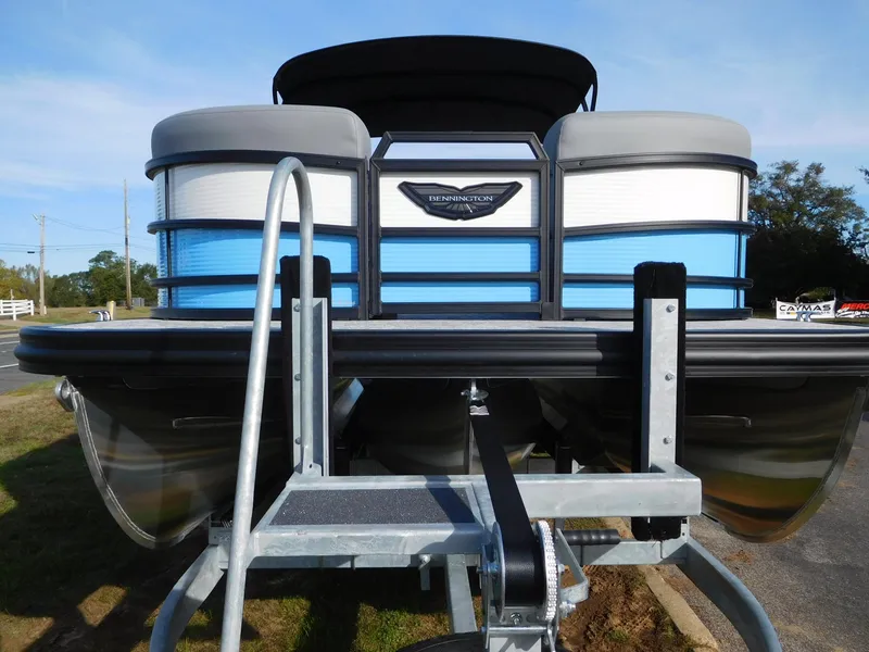 Slide: The Image of 2025 Bennington 24 MFB pontoon boat on trailer, front view. - 11