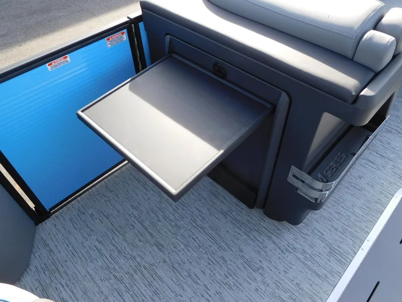 Slide: The Image of 2025 Bennington 24 MFB boat interior with fold-out table and cushioned seating. - 9