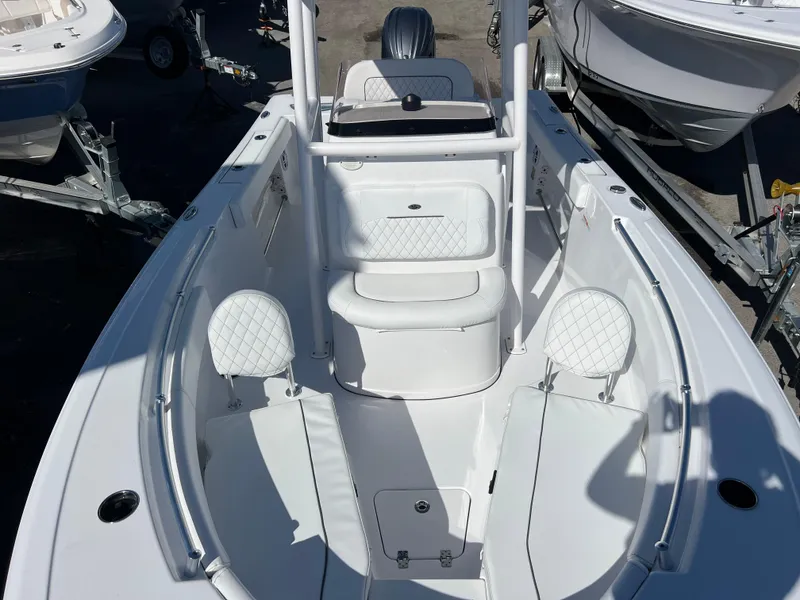 Slide: The Image of 2024 Sportsman Open 212 Center Console boat interior with white seating and console. - 11