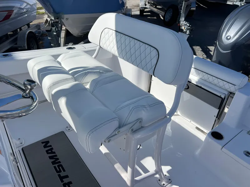 Slide: The Image of 2024 Sportsman Open 212 Center Console boat with white cushioned seating. - 13