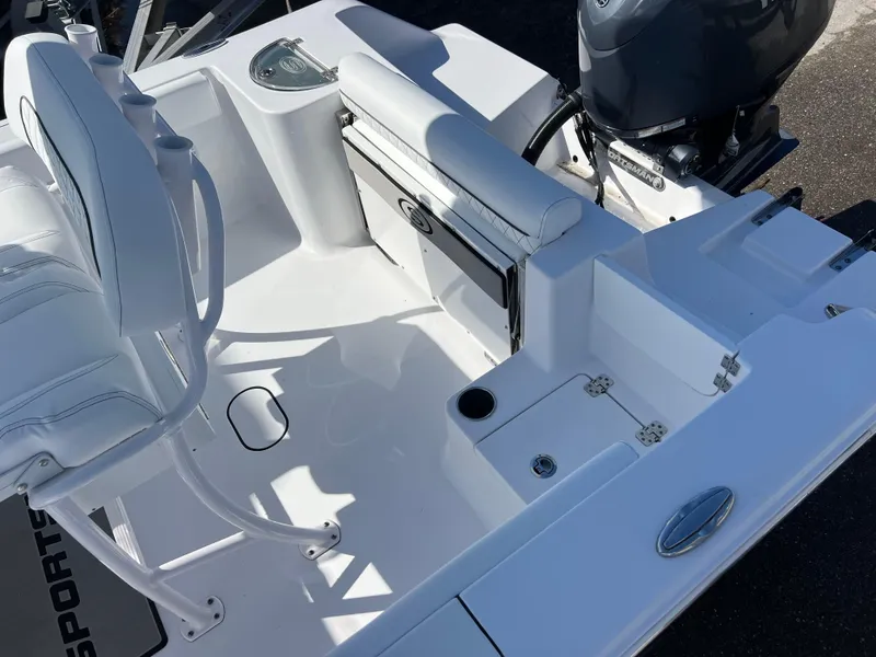 Slide: The Image of 2024 Sportsman Open 212 Center Console boat interior with seating and motor. - 14