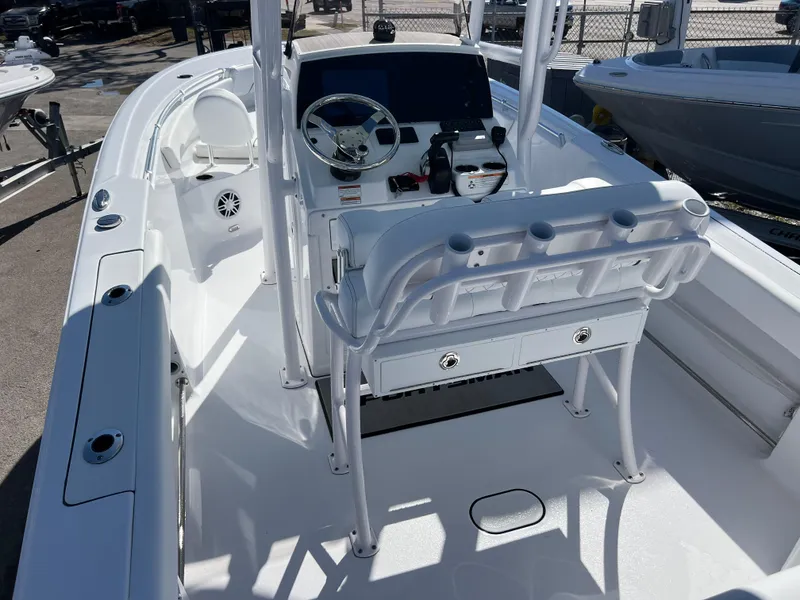 Slide: The Image of 2024 Sportsman Open 212 Center Console boat interior with steering wheel and seating. - 5