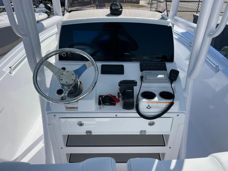 Slide: The Image of 2024 Sportsman Open 212 Center Console dashboard with steering wheel and controls. - 8