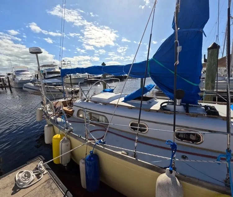 Slide: The Image of 1972 Cheoy Lee Luders 36 sailboat docked at marina under blue sky. - 22