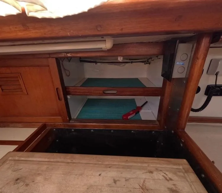 Slide: The Image of Interior of 1972 Cheoy Lee Luders 36 sailboat with wooden cabinetry and storage space. - 24