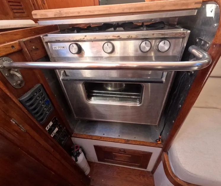 Slide: The Image of 1972 Cheoy Lee Luders 36 yacht kitchen with stainless steel stove and oven. - 25