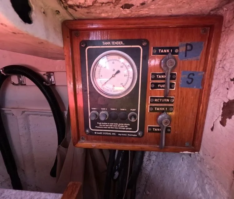 Slide: The Image of 1972 Cheoy Lee Luders 36 tank tender gauge panel with switches and labels. - 31