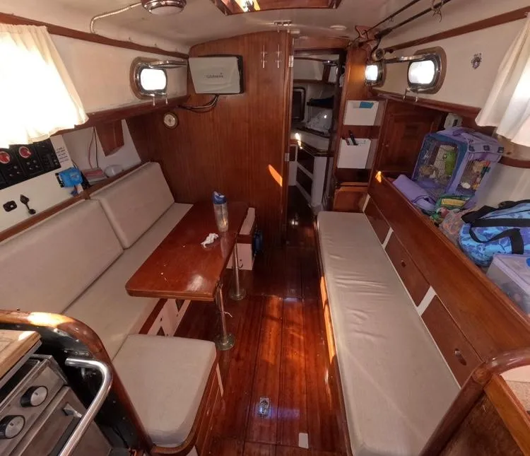 Slide: The Image of Interior of 1972 Cheoy Lee Luders 36 sailboat with wooden furnishings and seating. - 32