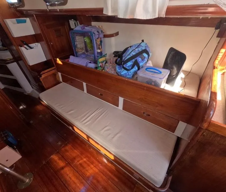 Slide: The Image of Interior of 1972 Cheoy Lee Luders 36 sailboat with wooden seating and storage. - 33