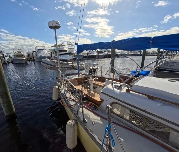 Slide: The Image of 1972 Cheoy Lee Luders 36 sailboat docked at marina under blue sky. - 4