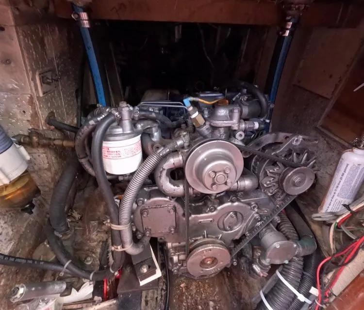 Slide: The Image of Engine compartment of 1972 Cheoy Lee Luders 36 sailboat, showcasing mechanical components. - 44