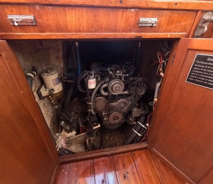 Slide: The Image of Engine compartment of a 1972 Cheoy Lee Luders 36 sailboat, showcasing mechanical components. - 45