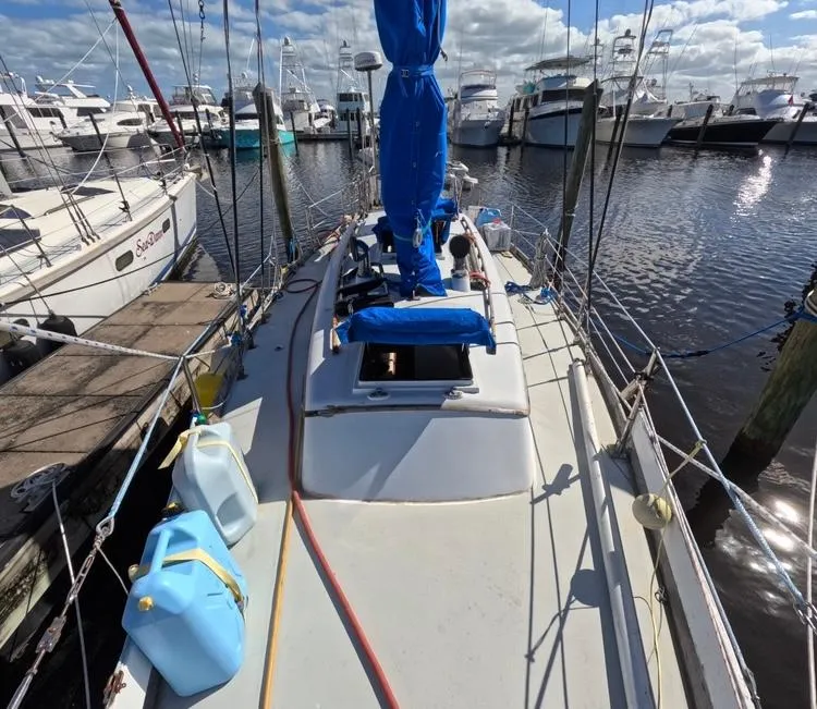 Slide: The Image of 1972 Cheoy Lee Luders 36 sailboat docked at marina, blue sail cover, sunny day. - 6