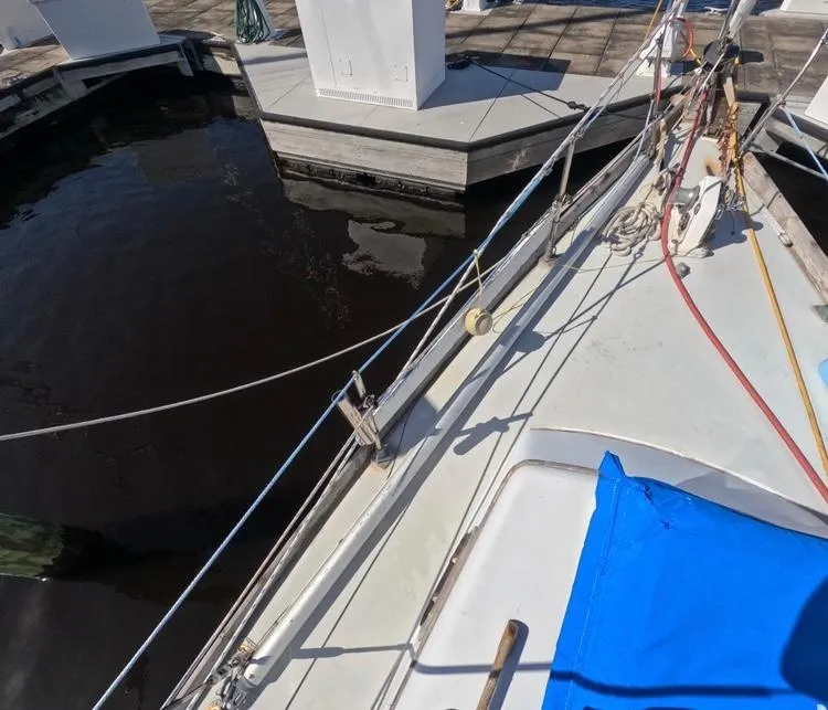 Slide: The Image of 1972 Cheoy Lee Luders 36 sailboat docked at marina, featuring deck and rigging. - 9