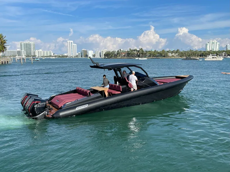 Slide: The Image of 2023 Skipper-BSK 42 boat cruising in sunny coastal waters. - 13