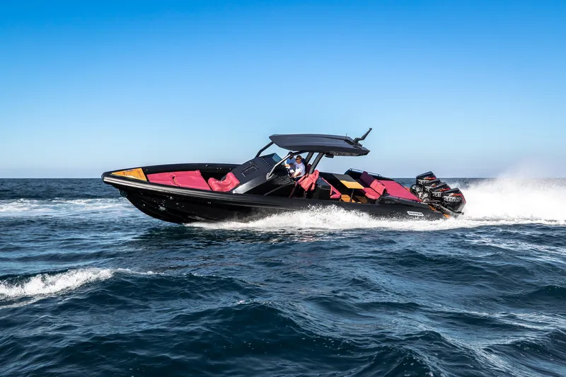 Slide: The Image of 2023 Skipper-BSK 42 speedboat cruising on open water. - 13