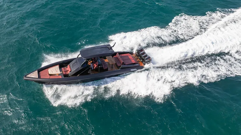 Slide: The Image of 2023 Skipper-BSK 42 boat cruising on open water, aerial view. - 24