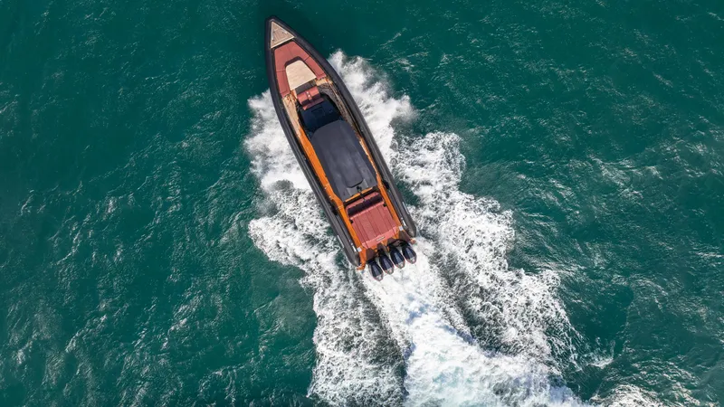 Slide: The Image of Aerial view of 2023 Skipper-BSK 42 speedboat cruising through turquoise waters. - 23