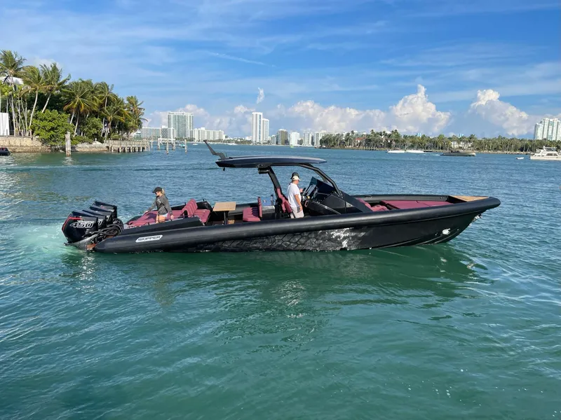 Slide: The Image of 2023 Skipper-BSK 42 boat cruising in sunny coastal waters. - 19