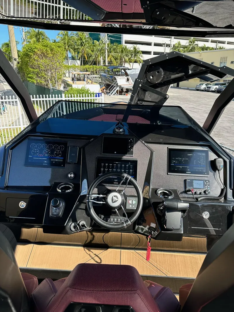 Slide: The Image of 2023 Skipper-BSK 42 boat cockpit with advanced navigation controls and sleek design. - 21