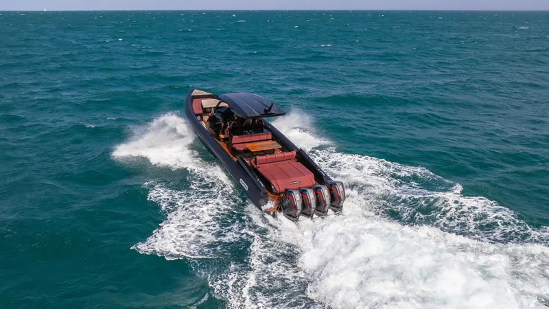 Slide: The Image of Skipper-BSK 42 boat cruising on open sea, 2023 model, with powerful engines. - 23