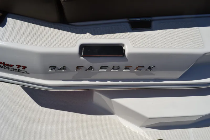 Slide: The Image of 2013 Regal 24 FasDeck boat, close-up of model name on white surface. - 12
