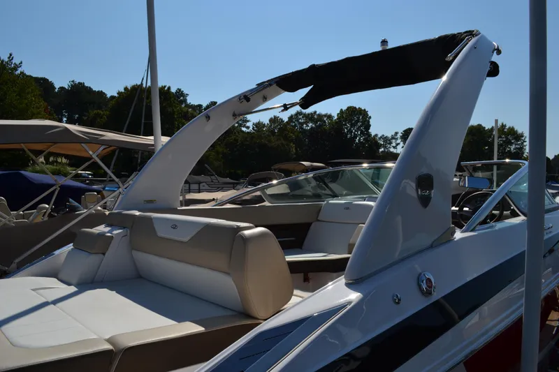 Slide: The Image of 2013 Regal 24 FasDeck boat with sleek design and comfortable seating. - 15