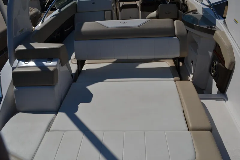 Slide: The Image of 2013 Regal 24 FasDeck boat interior with spacious seating and sunbathing area. - 19