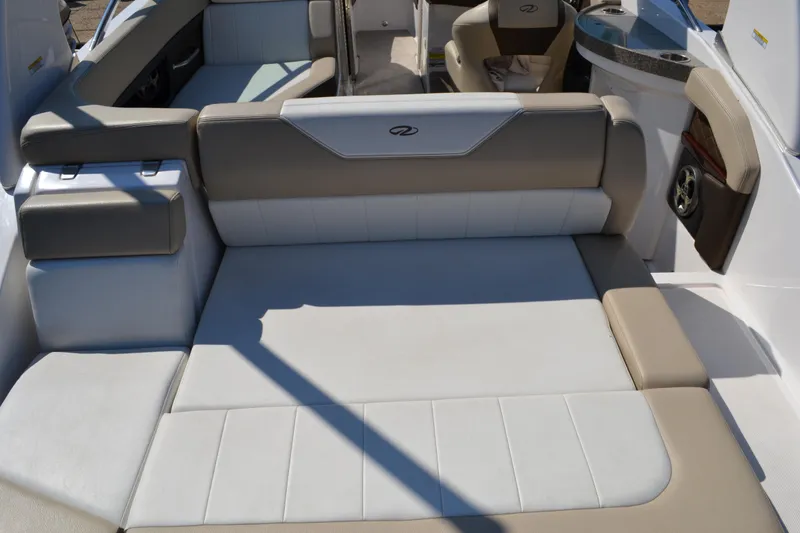 Slide: The Image of 2013 Regal 24 FasDeck boat interior with beige and white seating. - 21