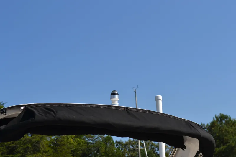 Slide: The Image of Regal 24 FasDeck 2013 boat canopy against clear blue sky. - 23