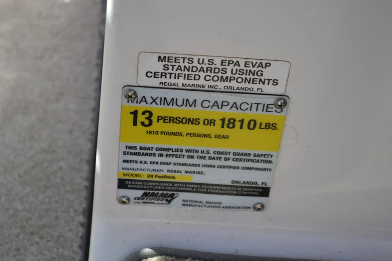 Slide: The Image of Capacity label on 2013 Regal 24 FasDeck boat: 13 persons or 1810 lbs. - 28