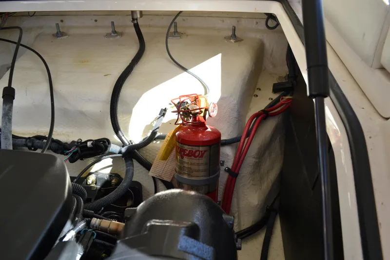 Slide: The Image of Engine compartment of 2013 Regal 24 FasDeck with fire extinguisher and wiring. - 31