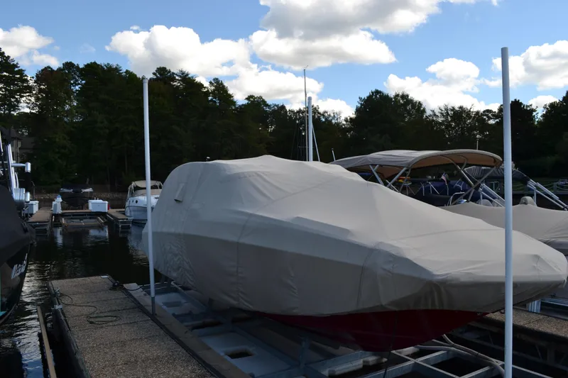Slide: The Image of 2013 Regal 24 FasDeck boat covered at marina dock. - 5