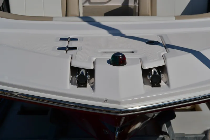 Slide: The Image of 2013 Regal 24 FasDeck boat bow with cleats and navigation light. - 7