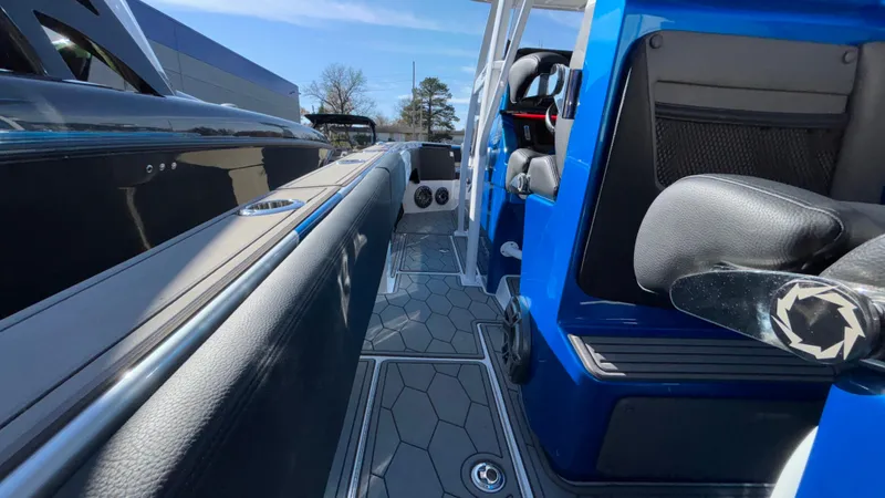 Slide: The Image of 2021 Fountain 34 SC boat interior with sleek seating and modern design. - 18