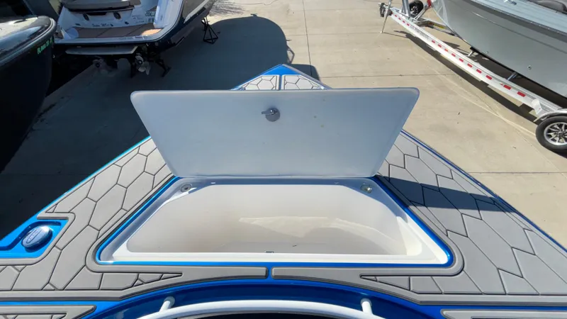 Slide: The Image of 2021 Fountain 34 SC boat with open storage compartment on deck. - 24