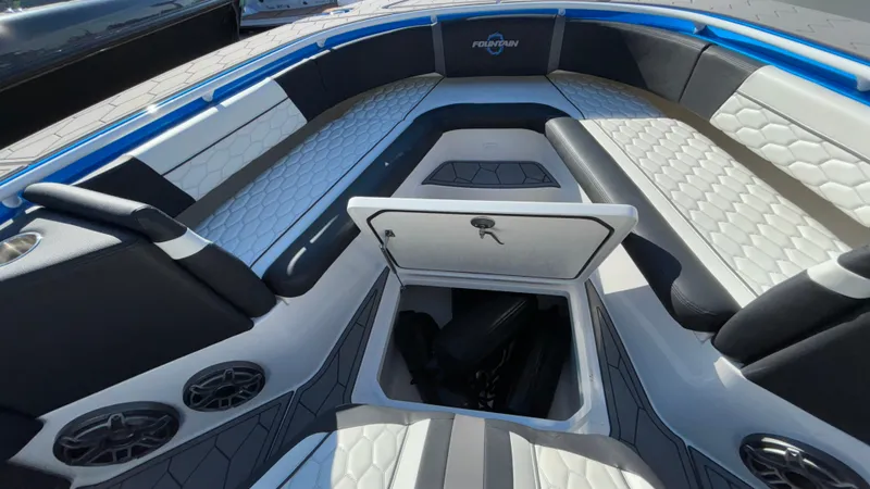 Slide: The Image of 2021 Fountain 34 SC boat interior with seating and storage compartment. - 27