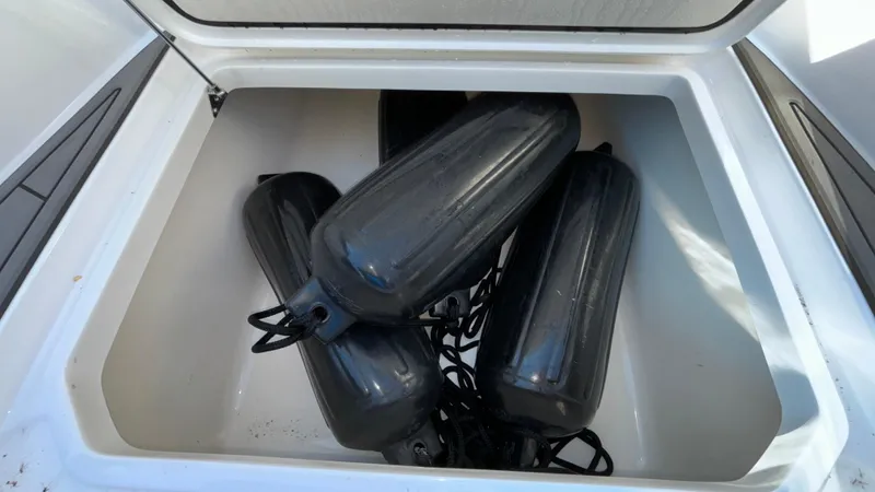 Slide: The Image of Boat storage compartment with black fenders, Fountain 34 SC, 2021 model. - 28