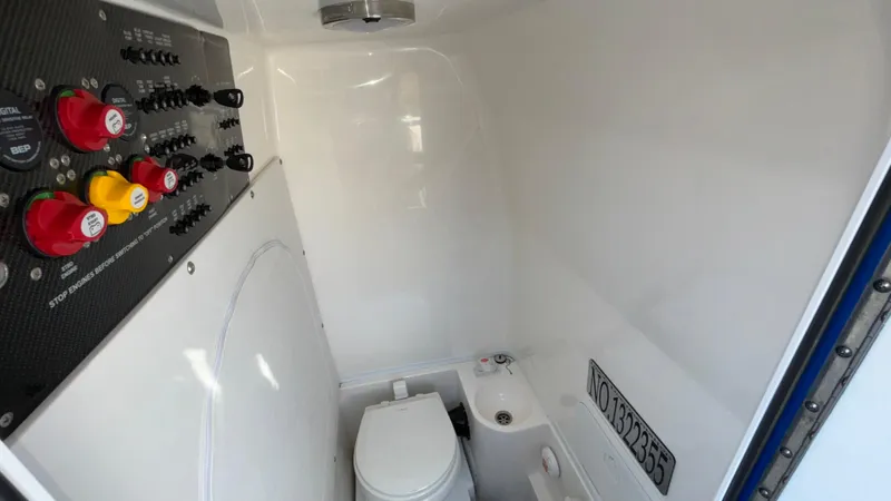 Slide: The Image of 2021 Fountain 34 SC boat interior with control panel and toilet. - 33
