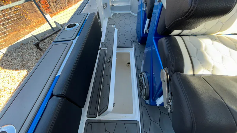 Slide: The Image of 2021 Fountain 34 SC boat interior with seating and storage compartments. - 36
