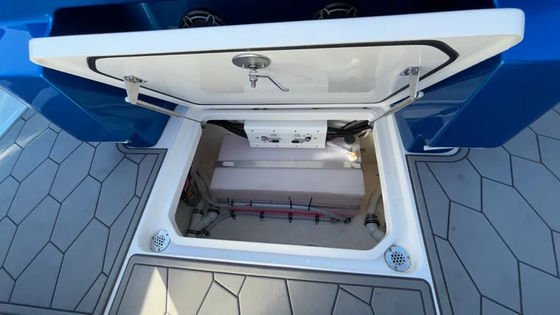 Slide: The Image of Open storage compartment on 2021 Fountain 34 SC boat, showcasing interior details. - 38