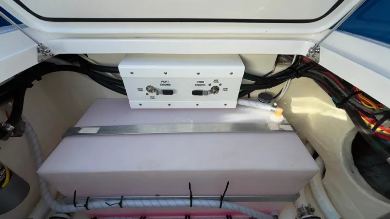 Slide: The Image of 2021 Fountain 34 SC boat engine compartment with control panel and wiring. - 39